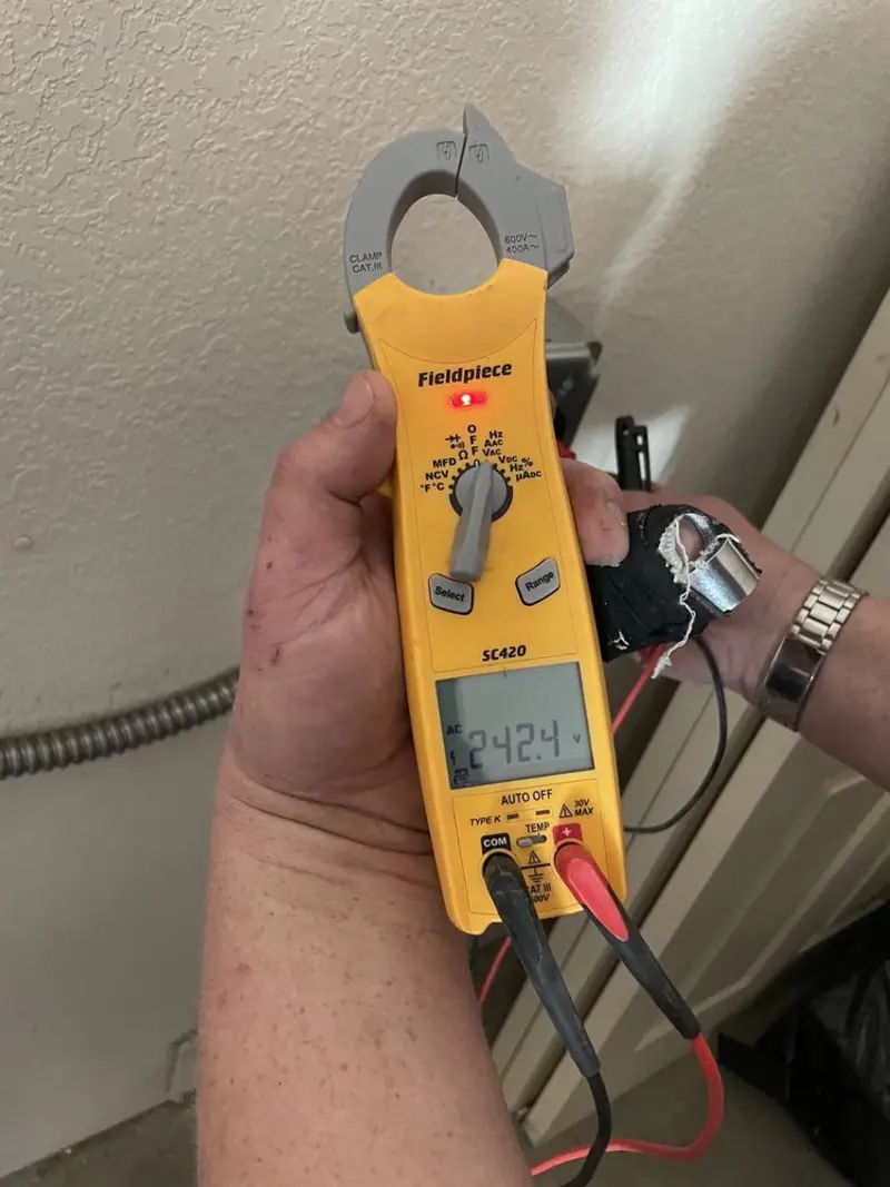 Voltage testing with clamp meter during Electrical Installation Services in Birch Run